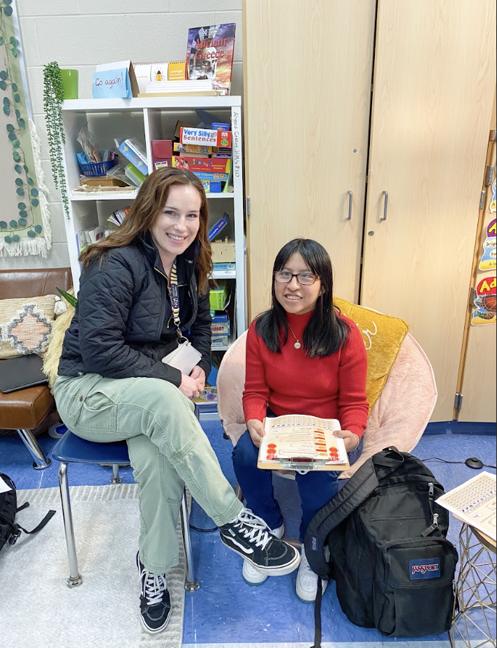 Anyuli Castillo Duncan (11) participates in a fun activity with middle school teacher Jenna Stone. 